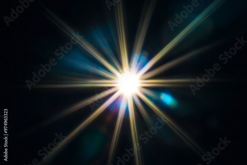 Light Flare on Black Background – Radiant Starburst Effect for Graphic Design