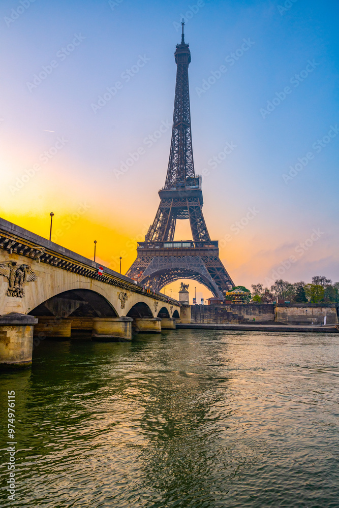 As dawn breaks, the Eiffel Tower stands majestically over the Seine River, casting reflections on the water while the city awakens in soft morning light. As dawn breaks, the Eiffel Tower stands majestically over the Seine River, casting reflections on the water while the city awakens in soft morning light.