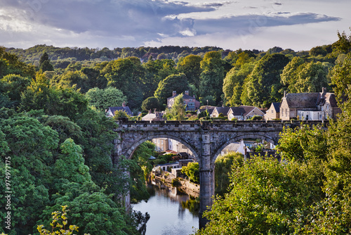 Scenic Stone Bridge Over River Surrounded by Greenery in Knaresborough, North Yorkshire