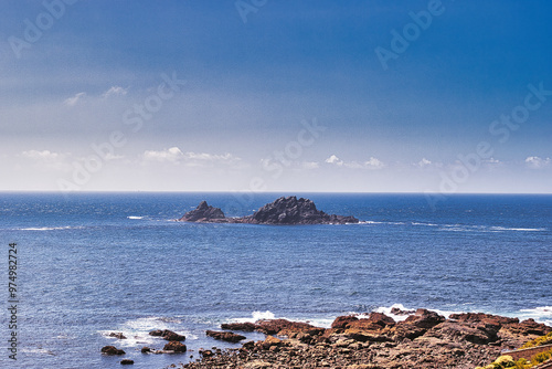 Tranquil Coastal Landscape with Distant Island at Cape Cornwall photo