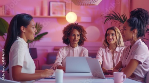 happy multiethnic female colleagues having a meeting