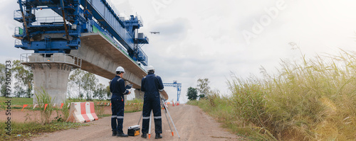 Engineer surveyor team Use drone for operator inspecting and survey construction site. Surveyors or explorer use drones to view construction sites or check security photo