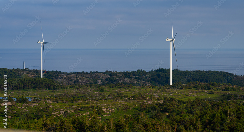 Wind power turbines in a hilly landscape. Wind power turbines in a hilly landscape.