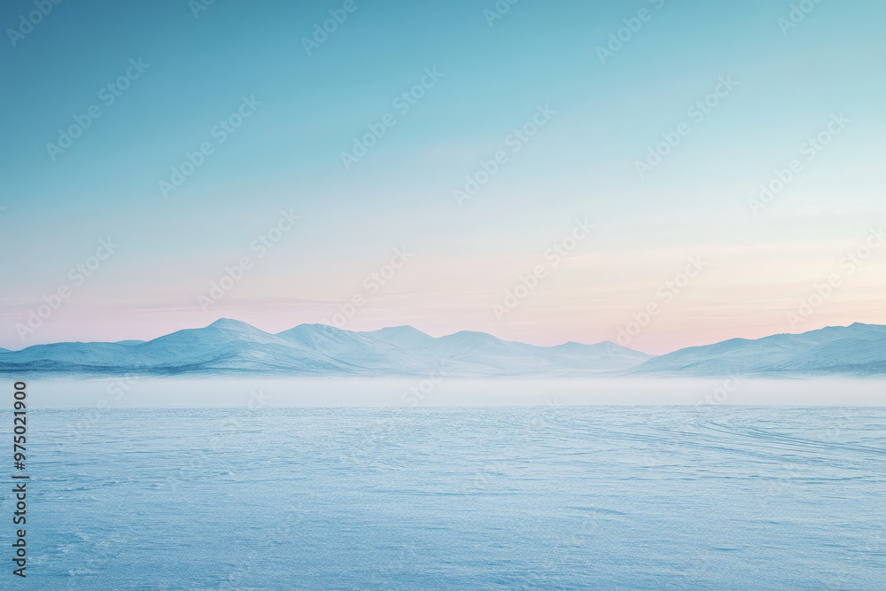 A serene snow-covered landscape with a gradient sky transitioning from a pale blue at the horizon to a deep indigo above. The snow-covered ground and distant mountains are bathed in the cool gradient