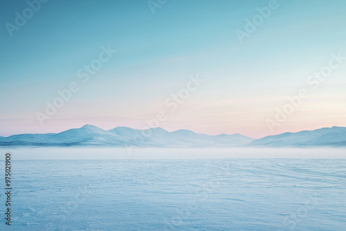 Obraz na płótnie A serene snow-covered landscape with a gradient sky transitioning from a pale blue at the horizon to a deep indigo above. The snow-covered ground and distant mountains are bathed in the cool gradient w salonie