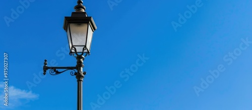 An Antique Style Black Street Lamp With The Blue Sky In The Background