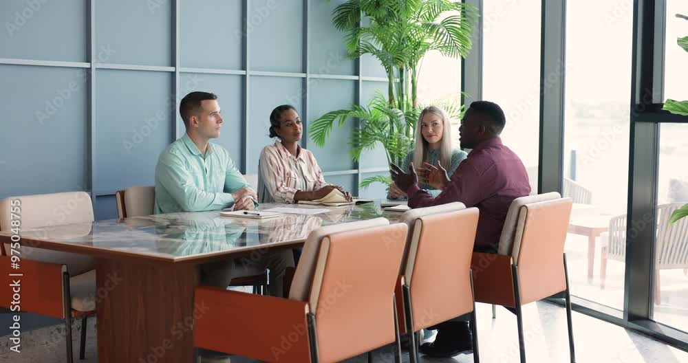 Diverse African American and Caucasian business group discussing project solutions, talking at meeting table, brainstorming on strategy in conference room, listening, nodding, saying no Diverse African American and Caucasian business group discussing project solutions, talking at meeting table, brainstorming on strategy in conference room, listening, nodding, saying no