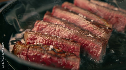 Perfectly seared, succulent pieces of steak sizzle in a hot pan, their edges crisping with gourmet excellence.