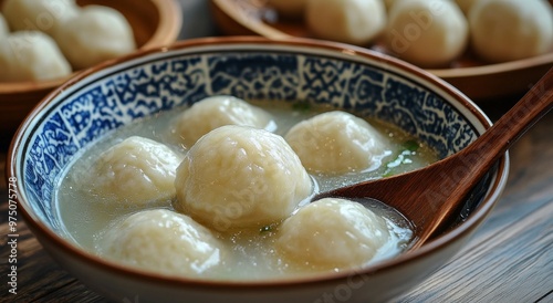 Traditional dessert of glutinous rice balls in sweet soup served in a decorat...