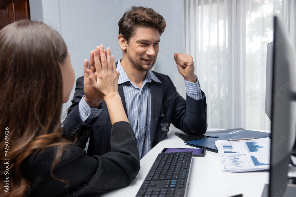 Fototapeta premium Successful in two business traders making hands high five with fist up to earn highest profit stock market in value currency online website on pc screens in real time data at modern office. Postulate.