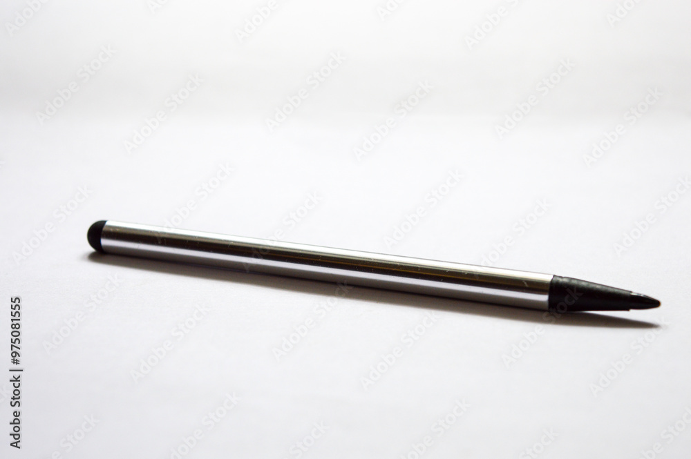 gray black stylus on white background close up photo gray black stylus on white background close up photo