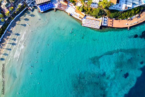 Fototapeta Naklejka Na Ścianę i Meble -  Kusadasi, Aydin, Turkey. Ladies Beach (Turkish: Kadinlar Denizi) in Kusadasi. Touristic beach resort town on Turkey. Aerial view of Kusadasi.