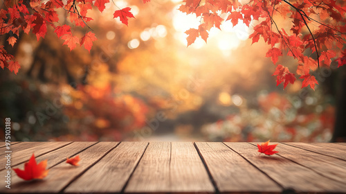 “Empty wooden tabletop with a blurred autumn tree and red leaf background—ideal for displaying or showcasing your products.”