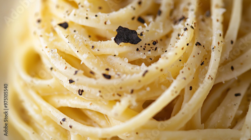 a close-up, top-down view of tagliolini with black truffle, filling the entire frame with the focus on the pasta's intricate details photo