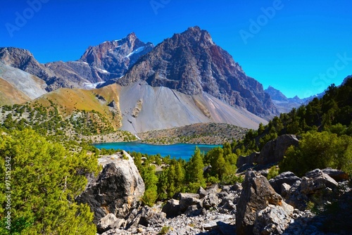 Stunning view of Alauddin Lake with Politekhnik Peak (4241 m) in the background, located in the Fann Mountains (part of the western Pamir-Alay mountain system, Tajikistan's Sughd Province) photo