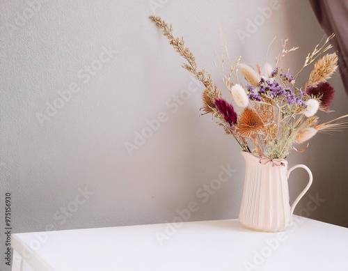 a composition of dried flowers artistically arranged on a minimalist white wall background generative ai photo