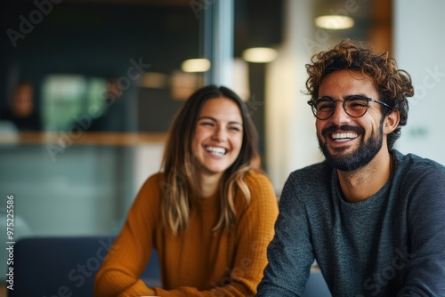 A man and a woman are smiling at the camera