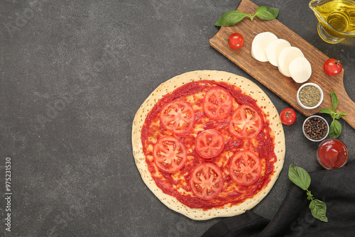 Uncooked pizza dough with t...