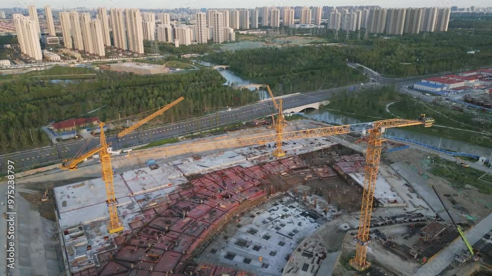 construction site aerial view of yellow crane with modern smart city ...