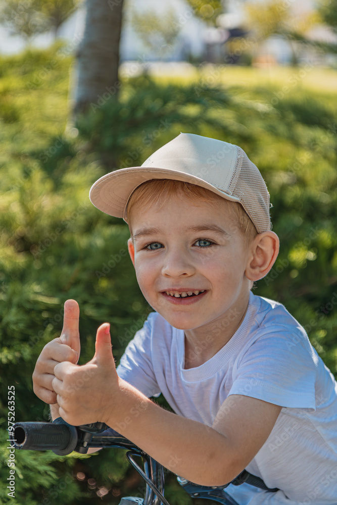 joyful and smiling boy shows like with two hands joyful and smiling boy shows like with two hands
