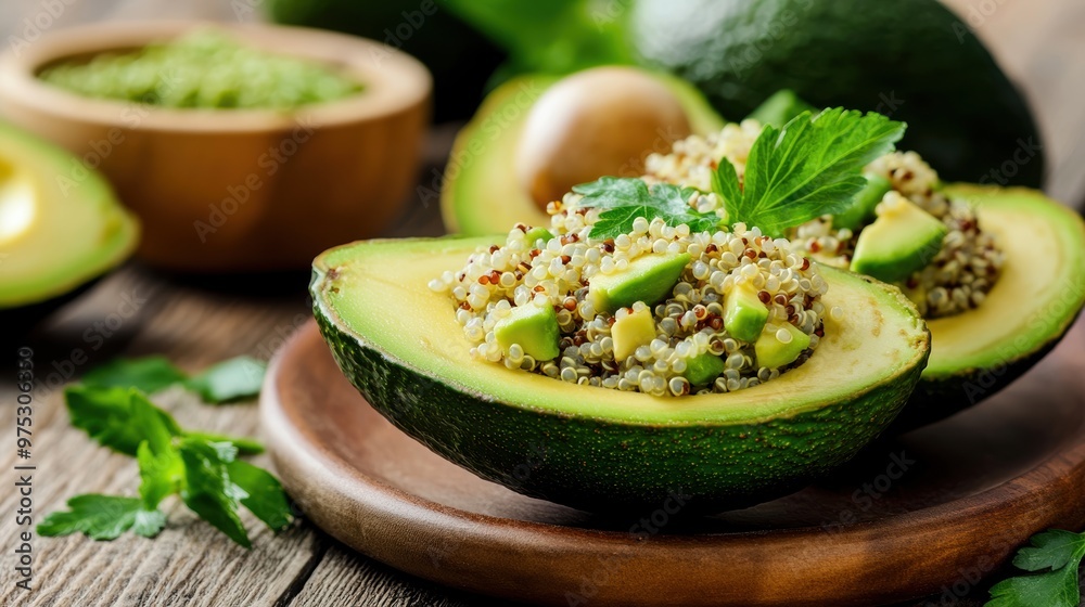 Delicious quinoa stuffed avocado with fresh herbs, perfect for a healthy meal or snack on a rustic wooden table. Delicious quinoa stuffed avocado with fresh herbs, perfect for a healthy meal or snack on a rustic wooden table.