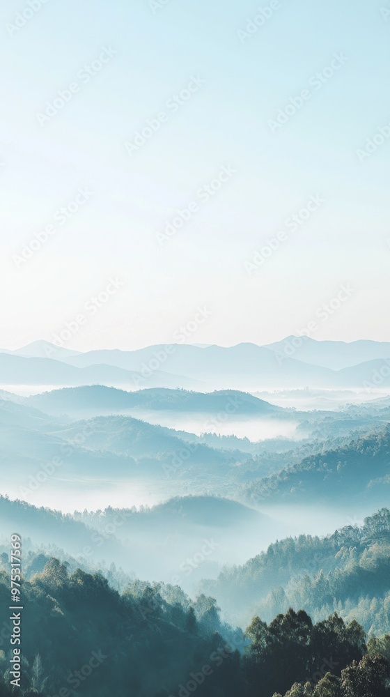 Misty mountains with layered landscape and blue sky, ethereal nature scene. Serenity and tranquility concept Misty mountains with layered landscape and blue sky, ethereal nature scene. Serenity and tranquility concept