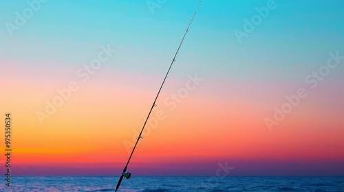 A minimalist image of a single, blue fishing rod against a dawn sky