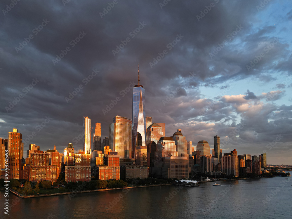 Fototapeta premium New York City top view. NYC aerial view, New York City Skyline with dramatic sky. Panoramic drone view on Manhattan in NY. Night in NYC. New York City Midtown skyline view at dusk with clouds.