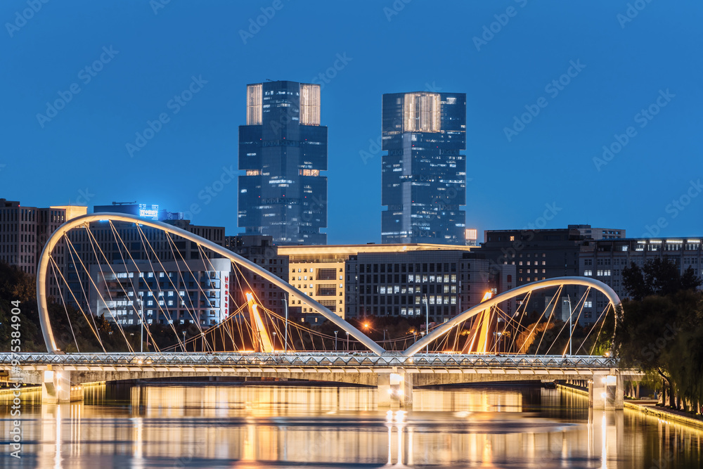 Obraz premium Night Scenery of Greenland Twin Towers and Jiuru Road Bridge in Zhengzhou, Henan Province, China