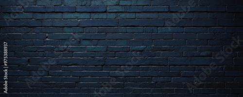 A dark blue brick wall with a subtle pattern of light and shadow, creating a textured and visually appealing background.