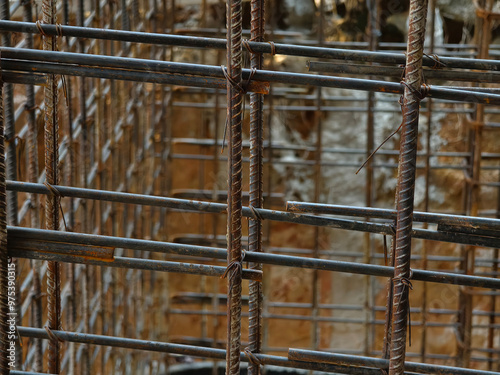 A construction site displaying a reinforced concrete foundation with steel rebar