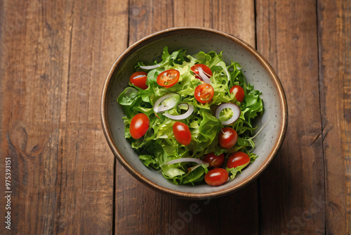 Realistic salad bowl on wood table with beautiful studio light and fresh organic vegetable leaf, onion, tomato ingredient for vegan food in concept of tasty delicious clean and healthy food