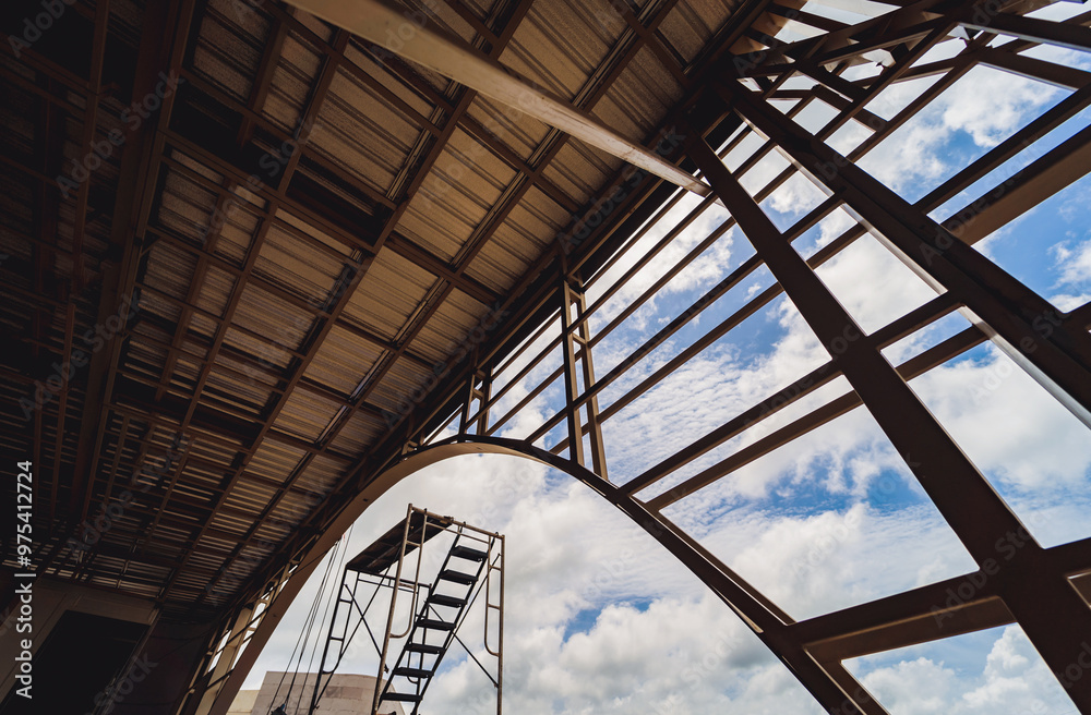 A structure featuring wooden slats on construction site contributing to its architectural style A structure featuring wooden slats on construction site contributing to its architectural style