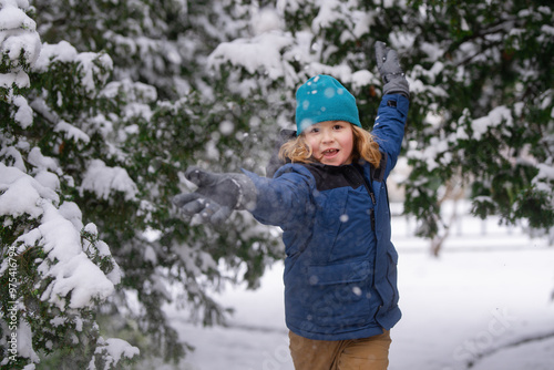 Kid snowball fight. Kid playing with snow ball in winter. Family vacation with child. Kid play with snowball and slide. Snowball fight. Winter holiday. Xmas winter vacation. Child Playing snowball.