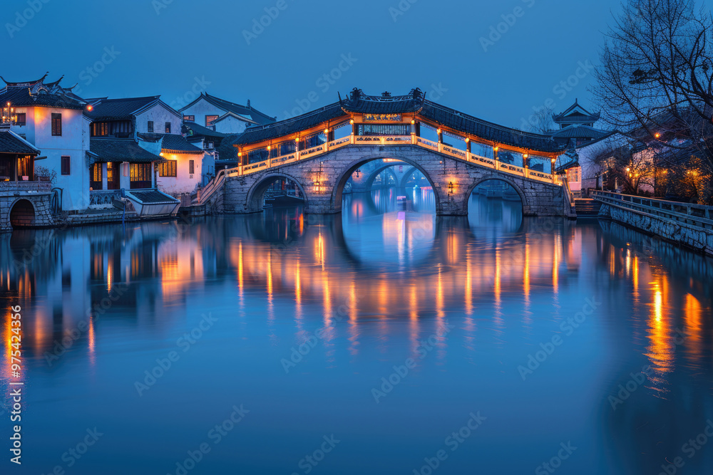 Chinese ancient town at night, ancient stone bridges and residential buildings Chinese ancient town at night, ancient stone bridges and residential buildings