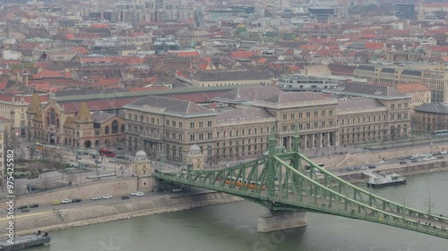 Liberty Bridge in Budapest with a yellow tram over it