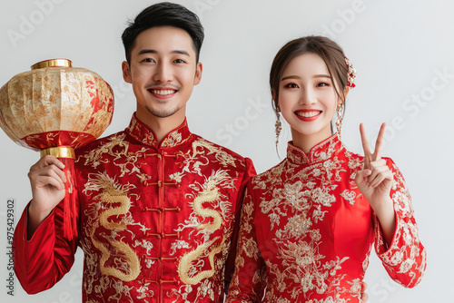 Young Chinese couple, holding red envelope gifts to bless