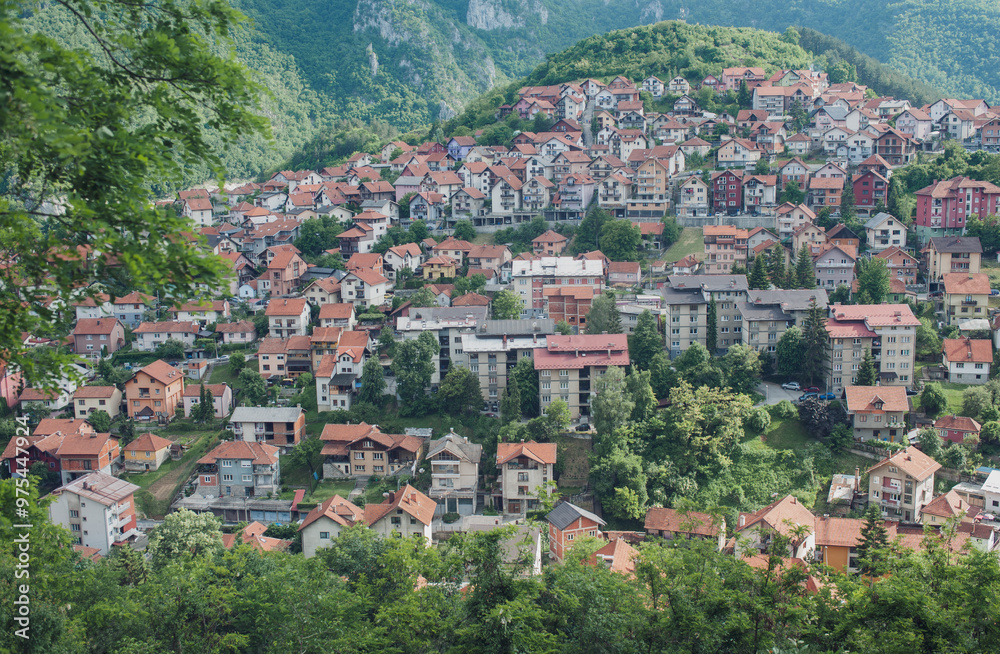 Fototapeta premium View of the small town with high-rise buildings and streets