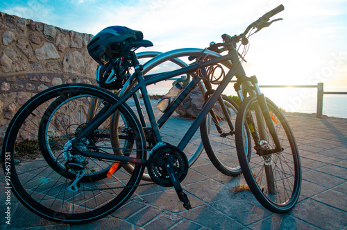 bike together to the beach on a sunset