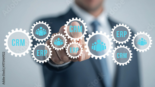 Businessman access CRM and ERP symbol to support business database analysis.