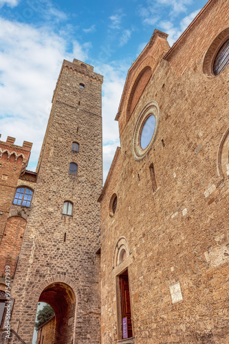 Impressive medieval towers and stone structures of San Gimignano, a UNESCO World Heritage Site.Medieval architecture of San Gimignano in Italy under a beautiful blue sky