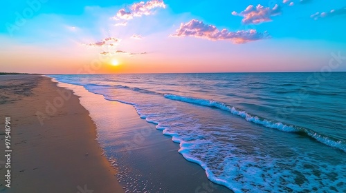 Beautiful Sunset Over Ocean Beach with Waves and Sandy Shore