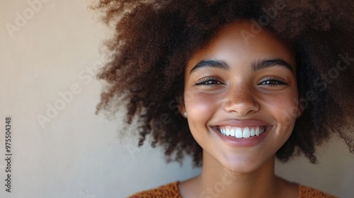 Bright Happy Youthful Portrait with Copy Space on Neutral Background