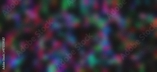 Blurred background of colored textures on a black background with a grainy texture