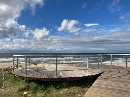 wooden boardwalk over dunes to lookout on top of Atlantic wall German World War Two bunker widerstandsnest 67 HL photo