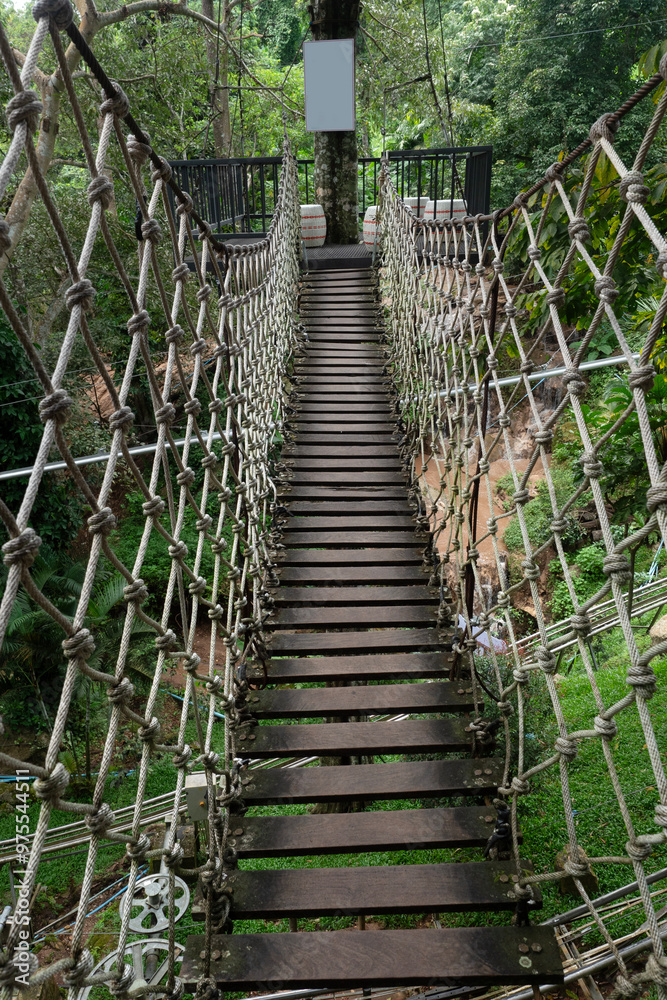 Suspension bridge in the evergreen forest for adventure trail in Chiang Mai. Suspension bridge in the evergreen forest for adventure trail in Chiang Mai.