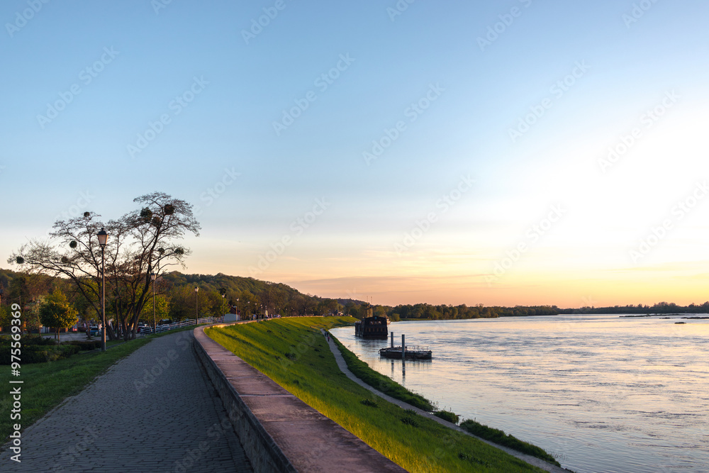 Wisla quay (Bulwar Nadwiślański) in Kazimierz Dolny, Lesser Poland (Małopolska). Evening view at sunset.
