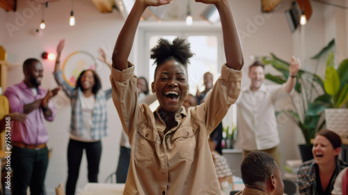 Group of friends celebrating a joyful moment indoors during a gathering in a bright, modern office space