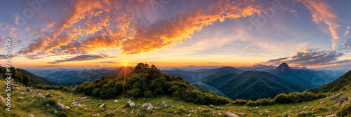 Golden hour sunset over a mountain landscape with calm orange skies and tranquil light, creating a peaceful atmosphere perfect for capturing the relaxing beauty of nature during serene summer evening