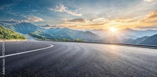 Fototapeta Naklejka Na Ścianę i Meble -  Empty asphalt road and mountain landscape with sunset background